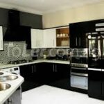 How to Mix Cabinet Colors and Countertops for a Cohesive Kitchen